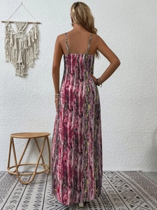 Detail view showing the back fit and abstract print of a long bohemian slip dress