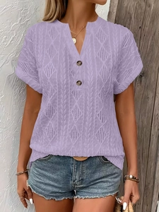 Detail of light purple knit T-shirt featuring hollow diamond mesh and buttoned V-neckline