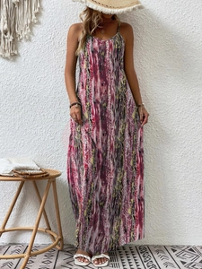 Detail of bohemian floral print maxi dress with spaghetti straps and vibrant patterns