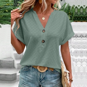 Detail of sage green V-neck T-shirt showing button closure and textured knit fabric