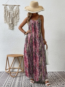 Detail of bohemian abstract print dress with fringe hat and woven sandals for summer