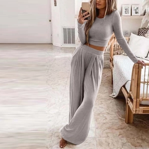 Women's 2-piece grey knit loungewear set with cropped long sleeve top and wide leg pants