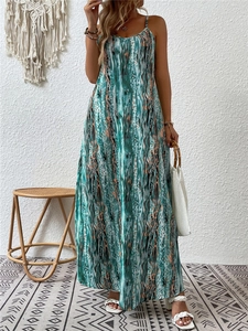 Detail view of bohemian strapless maxi dress featuring teal water ripple print and stripes