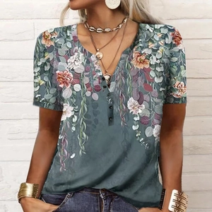 Close-up of floral print Henley top in dark green with button detail and boho pattern