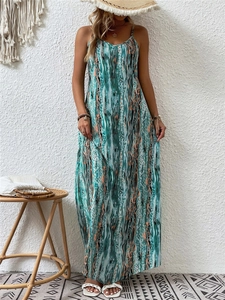 Detail view of Bohemian floral maxi dress featuring blue and orange abstract print textures