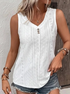 Close-up of white cotton eyelet fabric on sleeveless V-neck top with dark button details