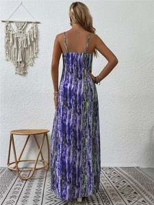 Detail of bohemian long dress showing backless thin straps and purple abstract print texture