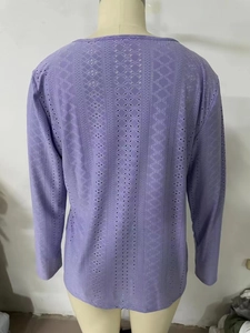 Detail of lavender purple long sleeve top with geometric hollow out textured fabric