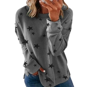 Detail of grey crewneck sweatshirt featuring black star print and side slit hem design
