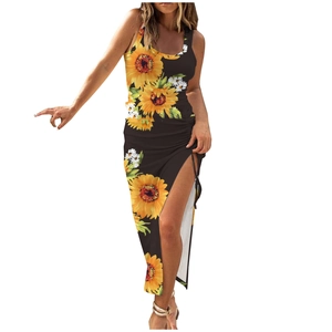 Detail of high side slit on a black ribbed sleeveless maxi dress with sunflower print