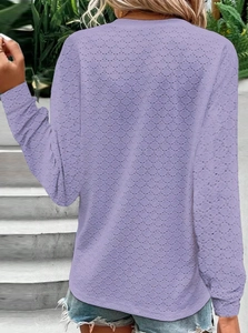 Back view of lavender long sleeve top featuring breathable pointelle knit texture detail