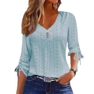 Light blue V-neck pointelle top with decorative buttons and bow-tie cuffs for women