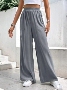 Pantaloni larghi grigi da donna con vita elastica e tasche per uno stile casual quotidiano