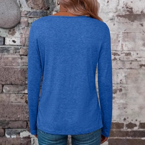Back view of a casual blue long sleeve V-neck top for women in a loose fit silhouette