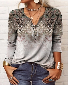 Women's V-neck long sleeve top featuring retro paisley print and decorative buttons