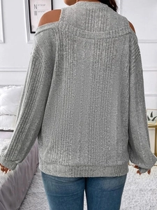 Women's loose grey cold-shoulder knit sweater with ribbed long sleeves and vertical texture