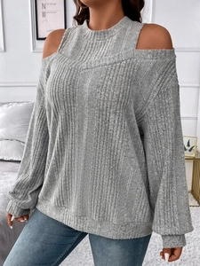 Detail of grey cold-shoulder knitted top showing vertical ribbed texture and slim round neck