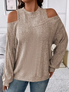 Detail of oatmeal ribbed knit texture on stylish off-the-shoulder long sleeve top
