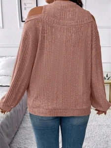Detail of dusty pink off-shoulder knit top with vertical ribbing and drop shoulder