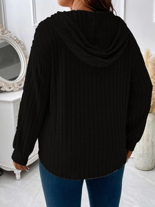 Back view of a black ribbed knit hoodie for women featuring casual loose fit and long sleeves
