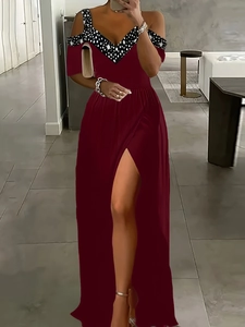 Detail of wine red maxi dress with cold shoulder design and high side slit feature