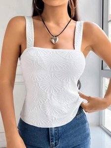 Close-up of white square neck camisole showing textured floral jacquard fabric detail