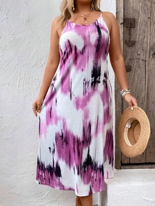 Detail of bohemian tie-dye maxi dress with pink and purple gradient patterns