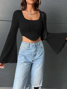 Detail of black U-neck crop top featuring dramatic bell sleeves and ribbed texture