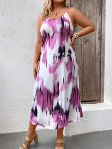 Detail of plus size tie-dye maxi dress with purple and black pattern and thin straps