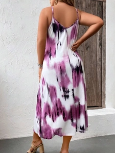Detail of thin straps and V-shaped back on a purple tie-dye maxi sundress