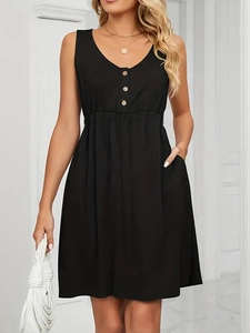 Detail of black V-neck sleeveless dress with wood buttons and functional side pockets