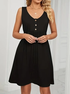 Detail of V-neckline with decorative wooden buttons on a black sleeveless dress