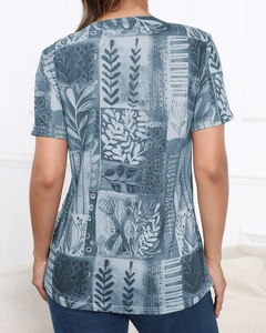 Detail view of vintage botanical floral and geometric print on the back of a women's T-shirt