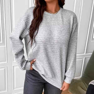 Women's gray waffle knit sweatshirt featuring a loose fit crewneck and drop shoulder design