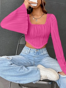 Detail of rose pink cropped top with vertical pleats, square neck and asymmetric hem