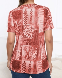 Detail of the back view of a women's T-shirt with botanical leaf and geometric square prints