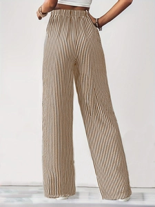 Back view of high-waisted wide-leg pants with brown and white vertical stripes