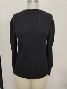 Detail of black rib-knit fabric and semi-high collar on long sleeve slim fit shirt