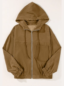 Detail of brown corduroy hooded jacket with drawstring, chest pocket and metal zipper