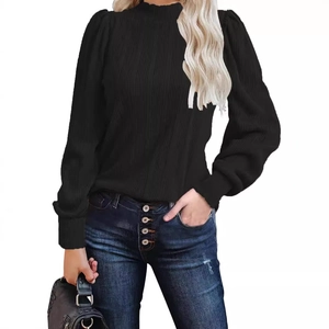 Women's black ribbed knit long sleeve t-shirt with mock neck and lantern sleeve design