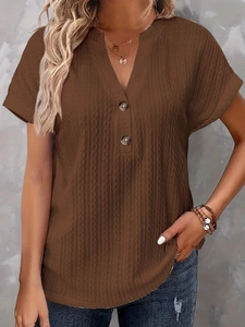 Detail of V-neck button design on brown ribbed short sleeve shirt for casual wear