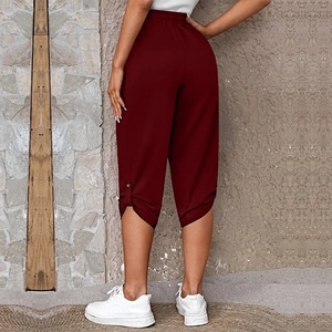 Rear view of maroon high waist cropped pants with buttoned cuffs on the leg opening