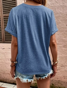 Detail view showing rolled cuff sleeves and blue marl fabric texture of the casual t-shirt