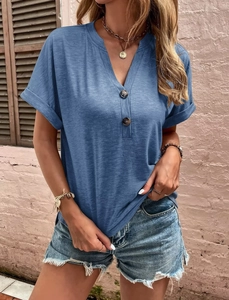 Close-up of V-neckline with wooden buttons on a grey-blue short sleeve t-shirt