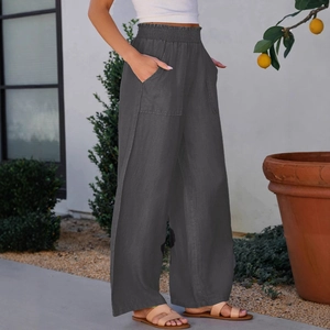 High-waist charcoal gray wide-leg trousers with elastic ruffled waist and large front pockets