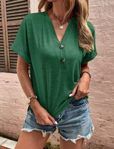 Detail of dark green slub knit V-neck t-shirt with buttons and denim shorts