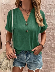 Detail of dark green V-neck T-shirt with decorative buttons and subtle ribbed texture