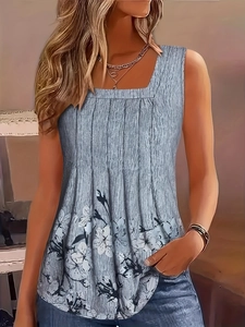 Detail of light blue pleated tank top featuring floral print and square neckline