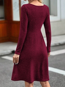 Back view of a burgundy ribbed knit long sleeve dress featuring an elegant slim fit design