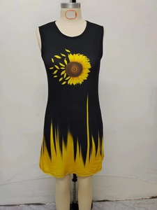 Detail of black sleeveless dress with sunflower print and yellow flame pattern design